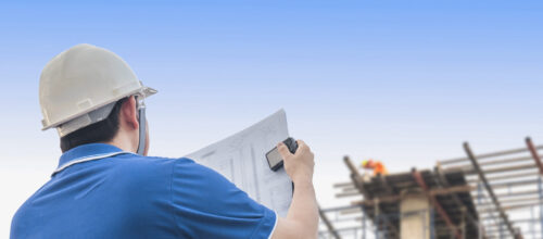 Engineer is inspecting his work in building construction site